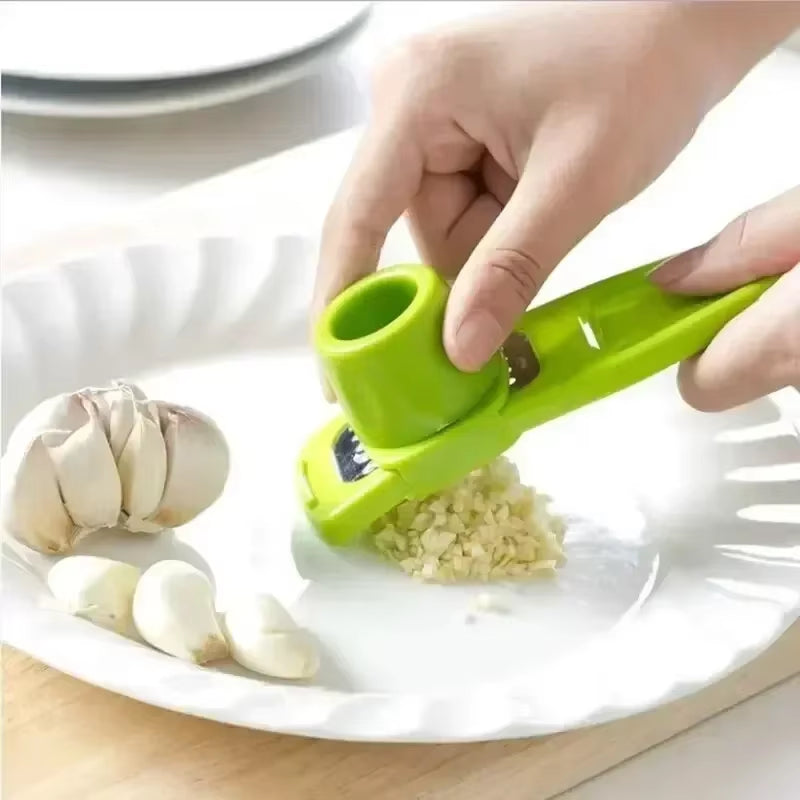 Garlic press in green and pink