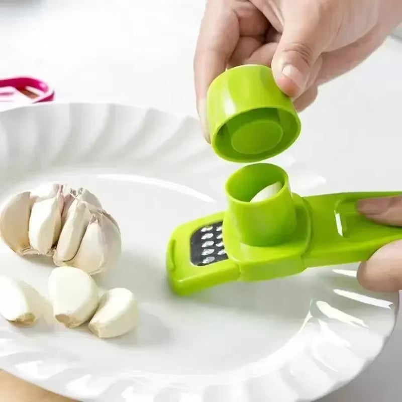 Garlic press mincing garlic clove